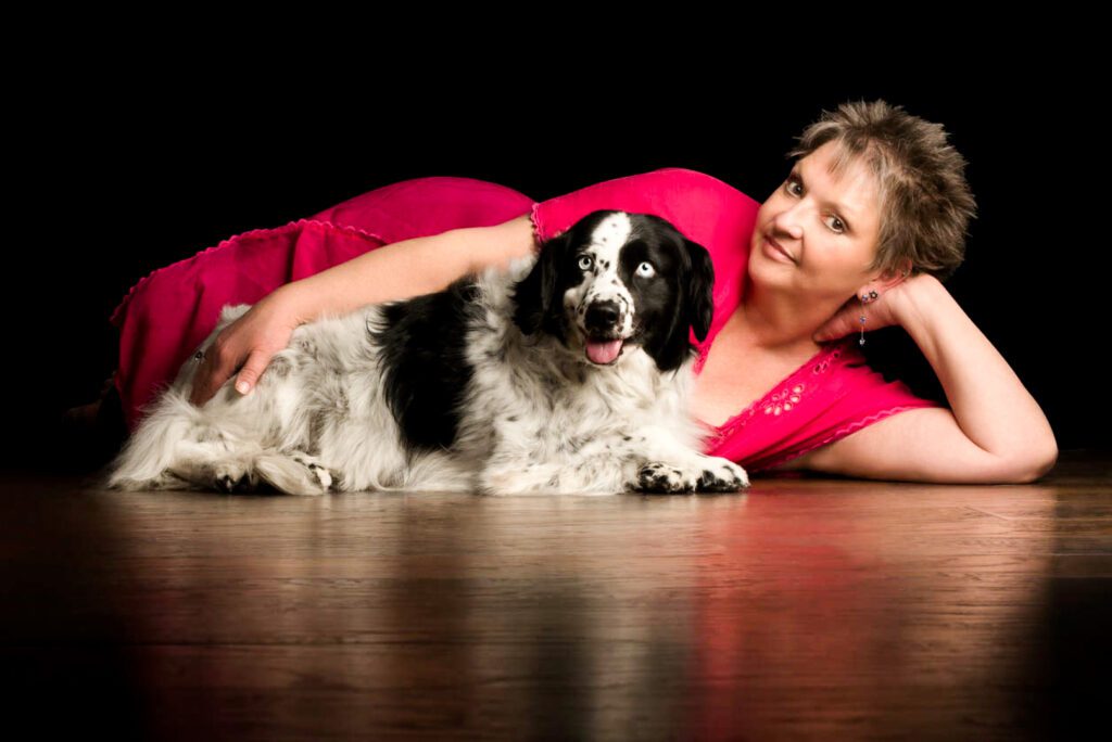 woman with black and white dog inside chicago's top pet and family photography studio