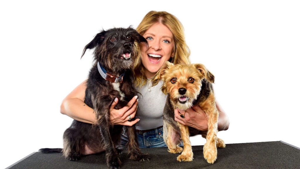 Family with two rescue dogs during a professional pet photography session in Chicago.
